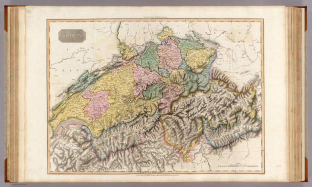 Ein altes Buch mit einer detaillierten Karte der Schweiz, auf der zusätzliche Informationen zum Karteninhalt gegeben sind.