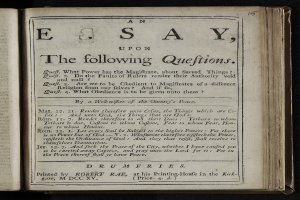 Ein aufgeschlagenes Buch mit den Worten "ein Aufsatz über die folgenden Fragen" darauf gegen einen schwarzen Hintergrund.
