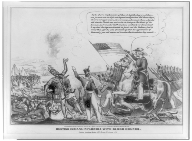 Schwarzes und weißes Foto einer Gruppe von Menschen, einige davon zu Pferde, mit einer Fahne im Hintergrund und dem Text "Jagen von Indianern in Florida mit Bluthunden" unten.