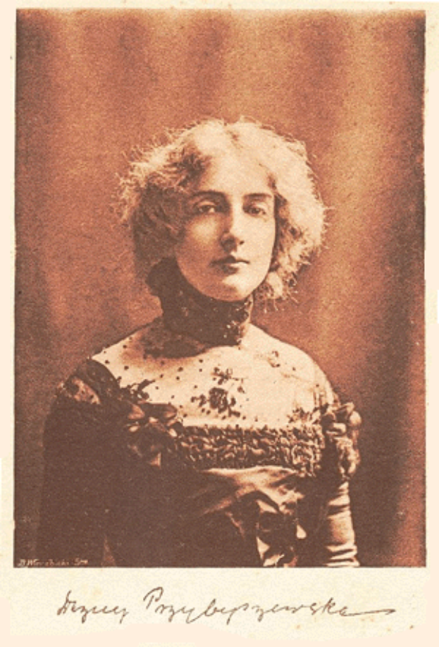 Ein altes Foto einer Frau mit lockigen Haaren in einem Kleid, mit dem Text 'Foto der Kaiserin' unten.